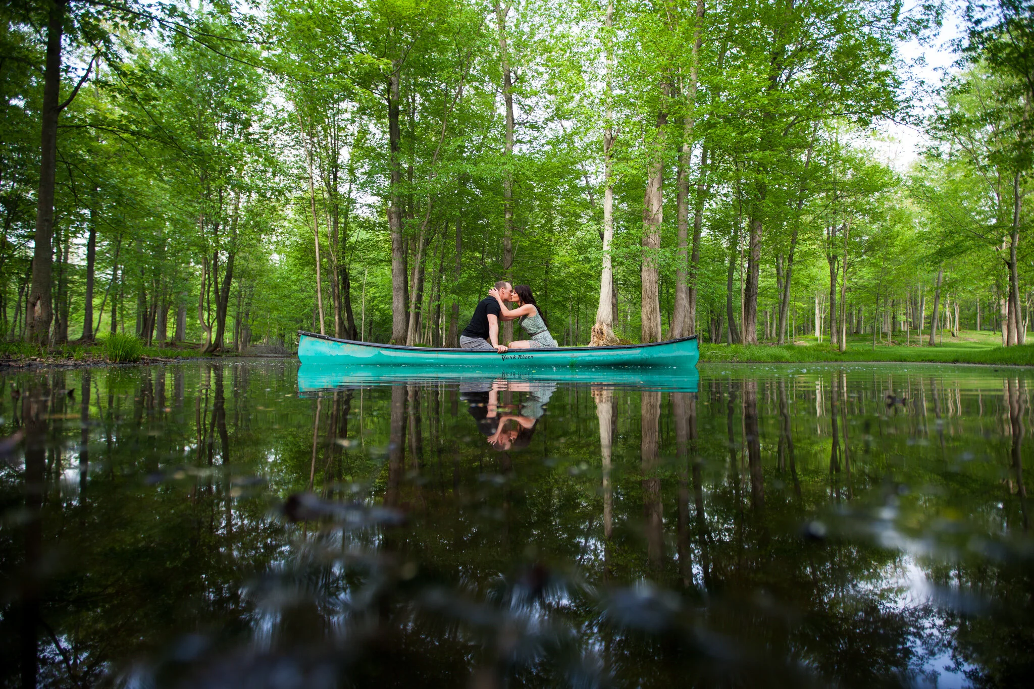 A couple beside a canoe at Fernwood Hills